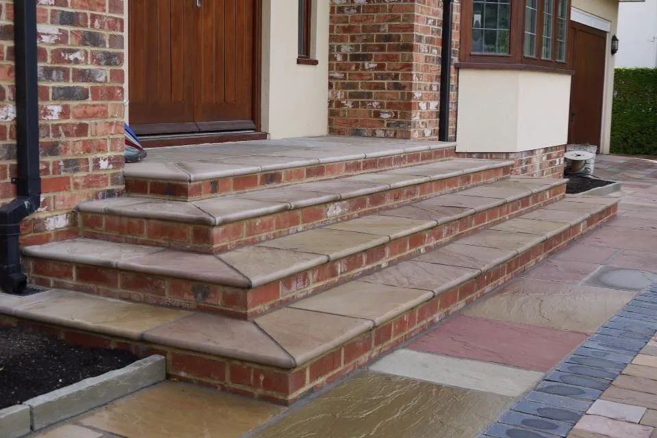 Urban Paving Bristol | A set of brick steps leading up to the front door of a house.
