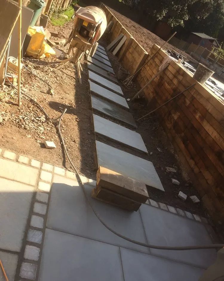 Urban Paving Bristol | A concrete walkway in a garden