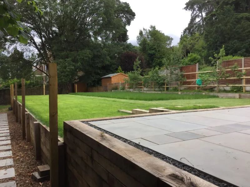 Urban Paving Bristol | A large lawn with a wooden fence surrounding it