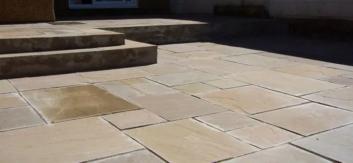Urban Paving Bristol | A stone walkway with stairs leading up to it