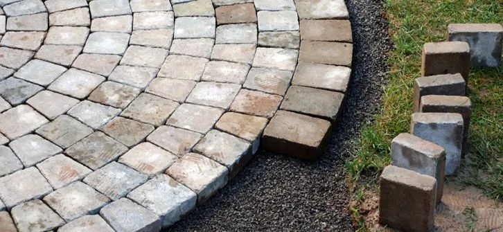 Urban Paving Bristol | A circular walkway made of bricks is being built.