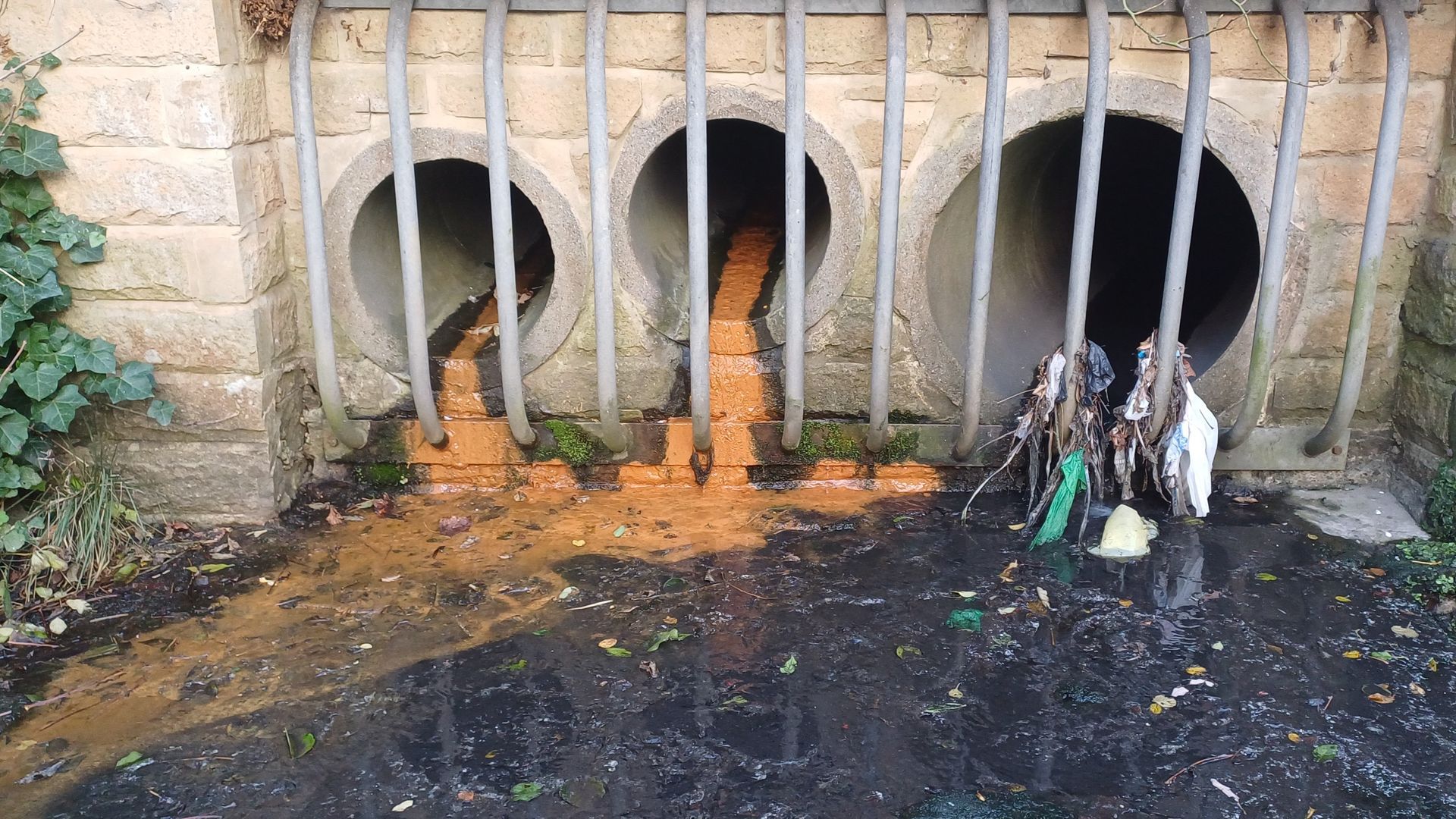 Close up of a combined sewer outfall (CSO) with pollution coming out of it.