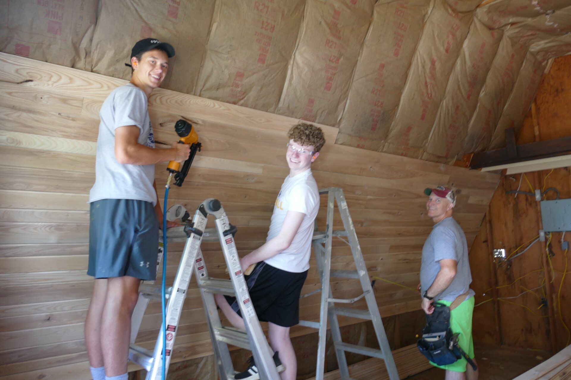 Boys doing construction in a house
