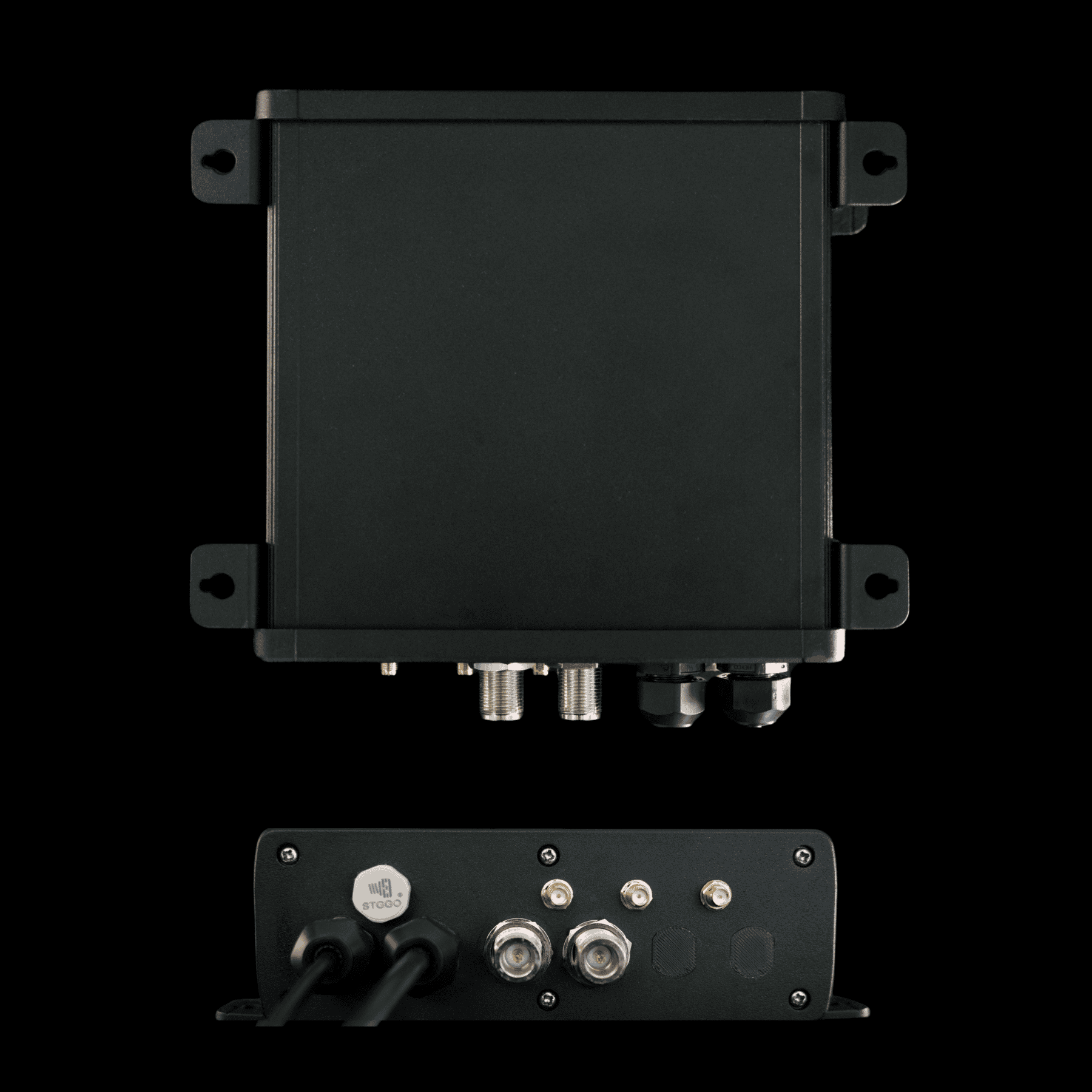 A silver, square-shaped SCAN~LINK device with four antenna connectors, set against a dark background.