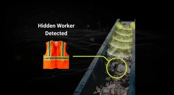 “HIDDEN WORKER DETECTED” text with orange safety vest on dark background beside a conveyor