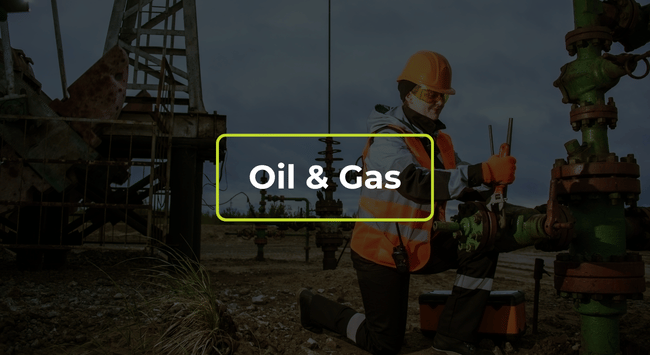 Oil and gas workers in orange safety gear at an industrial site, with “Oil & Gas” text overlay.