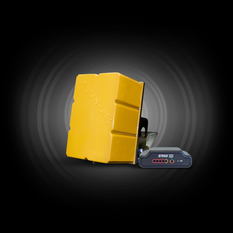 Yellow radar device with a black control panel on a dark background.
