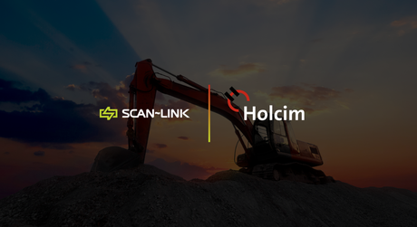 Excavator at dusk with SCAN-LINK and Holcim logos over a quarry mound