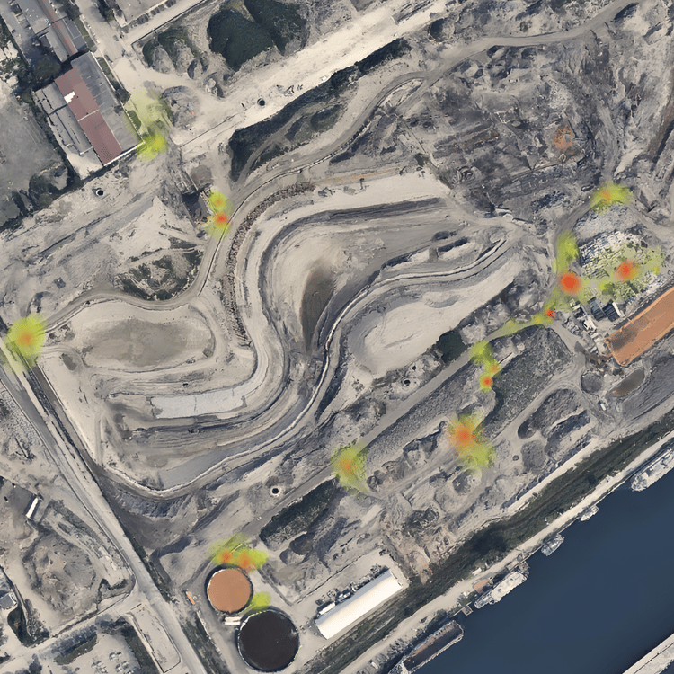 Aerial view of a winding quarry heatmap, indicating high-risk areas