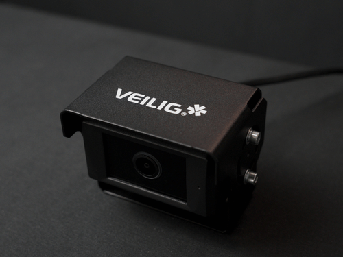 Black VEILIG dash camera with lens, shown on a dark surface
