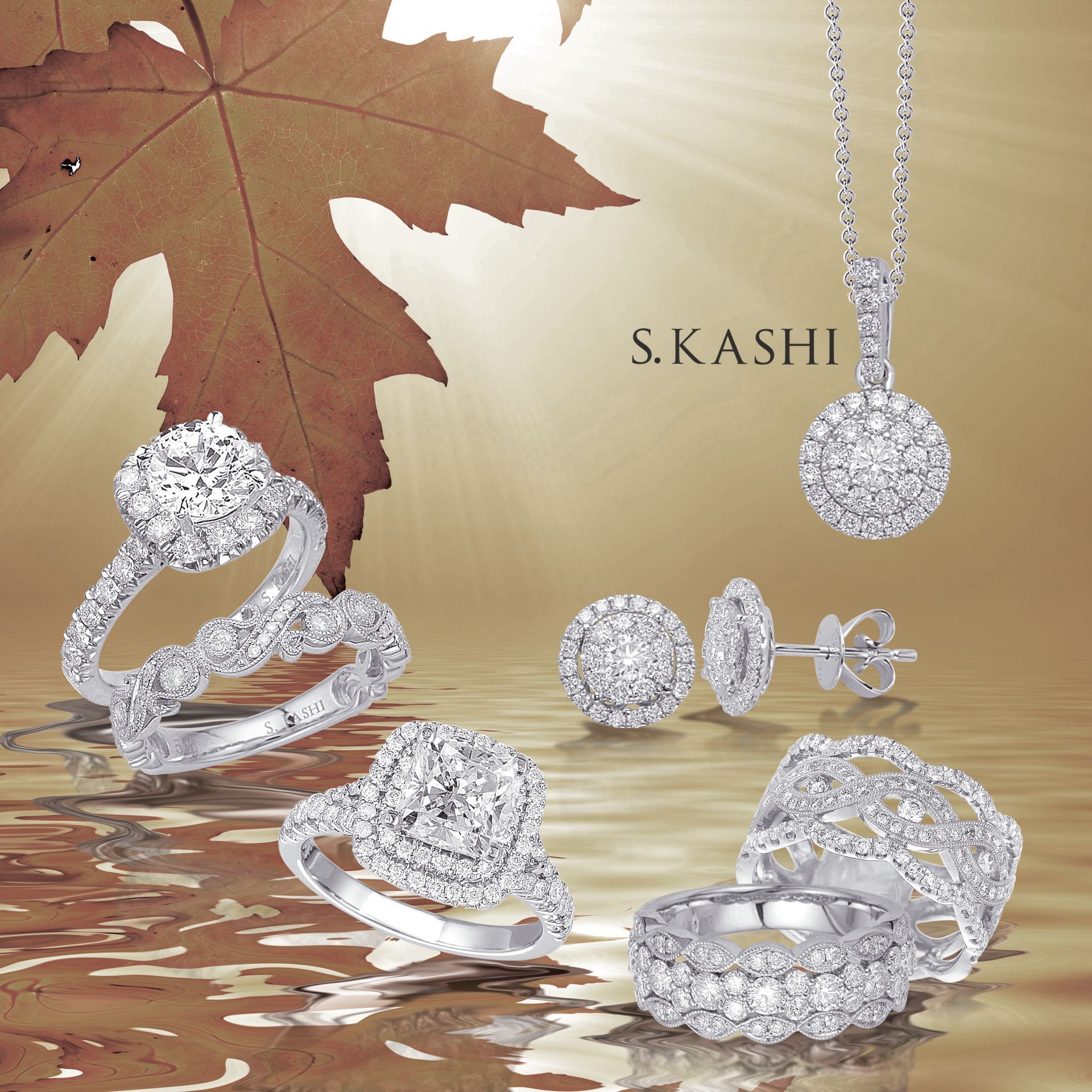 Silver diamond jewelry set on reflective surface with gold leaf background and S.KASHI branding