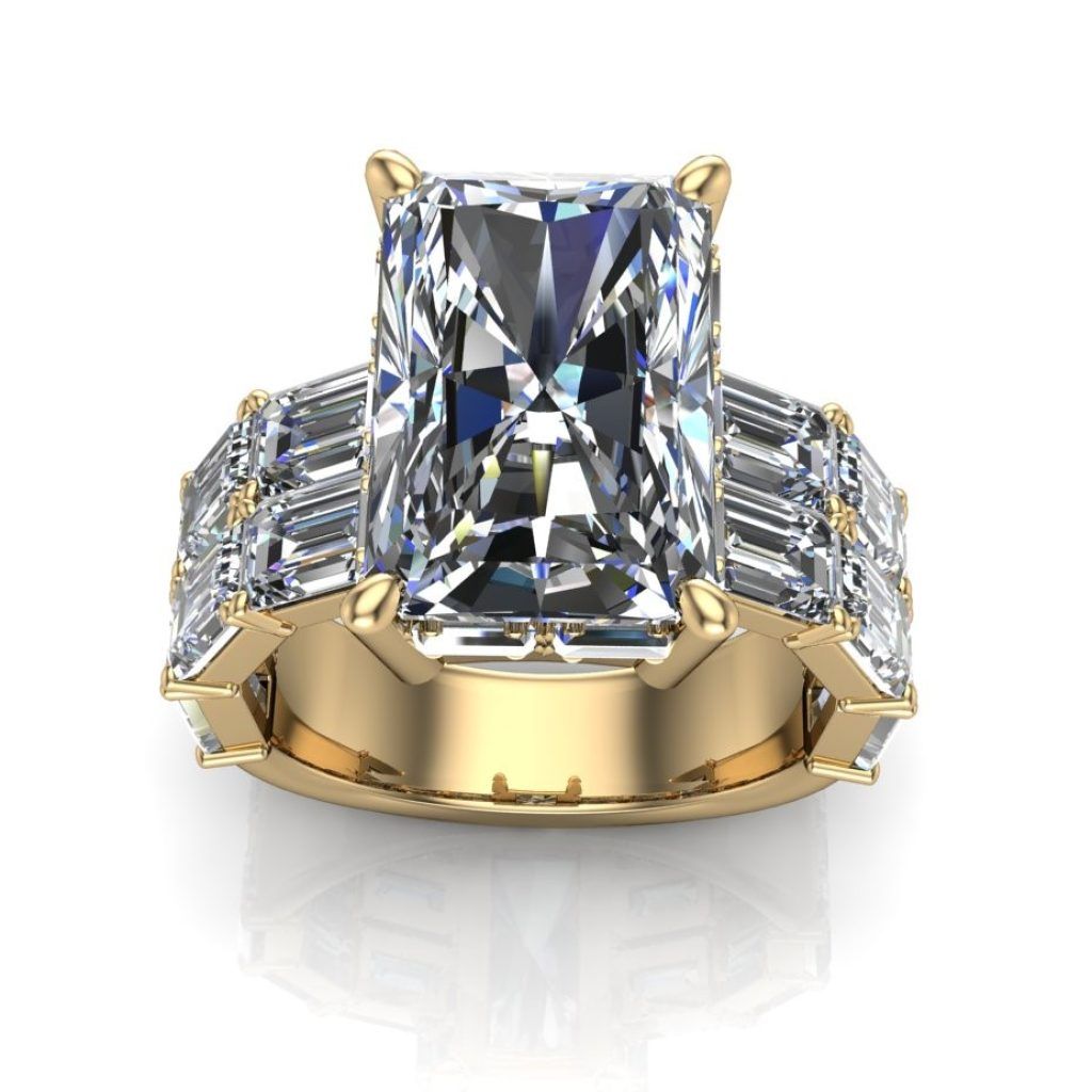 Gold ring with a large rectangular diamond and side baguette stones on a white background