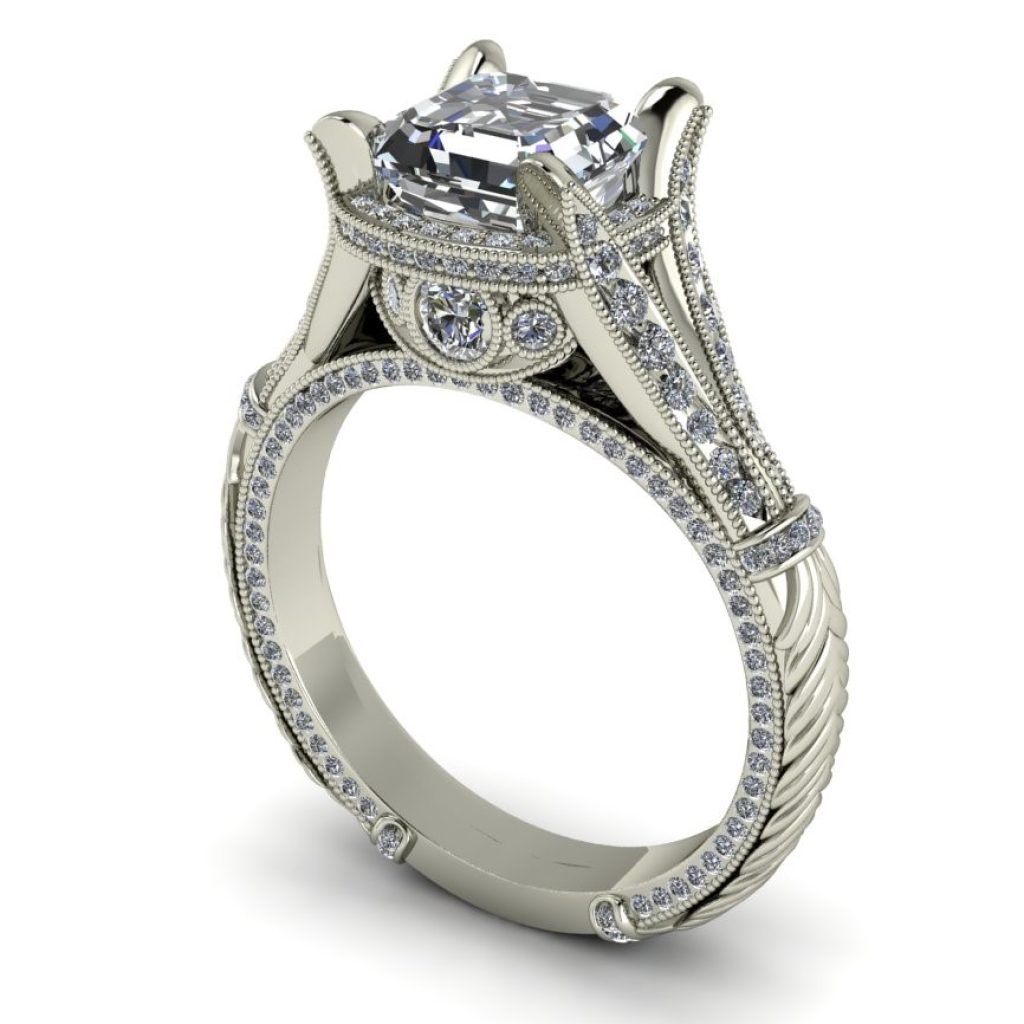 Silver diamond engagement ring with ornate setting and round center stone