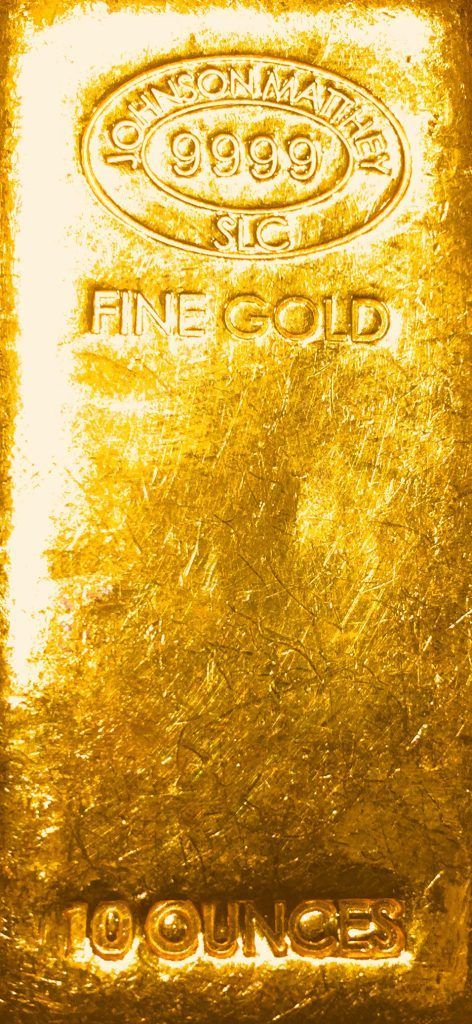 Gold bullion bar with an engraved stamp and “FINE GOLD 1000g” text on a textured gold background