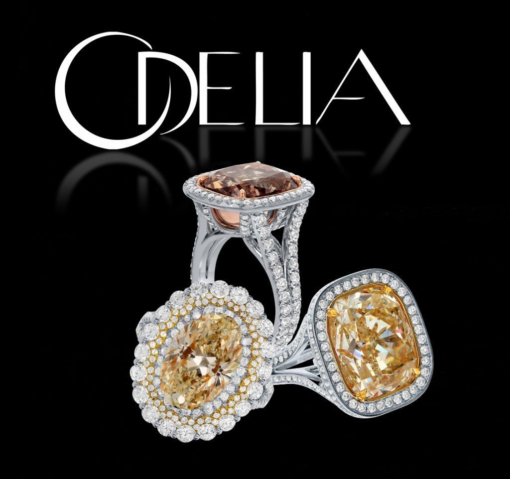 DELIA jewelry ad showing three diamond rings on a black background