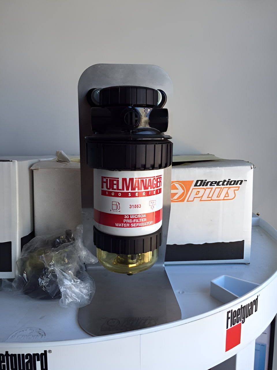 A Fuel Filter Is Sitting On Top Of A White Barrel — Filta-Wash Mackay In North Mackay, QLD