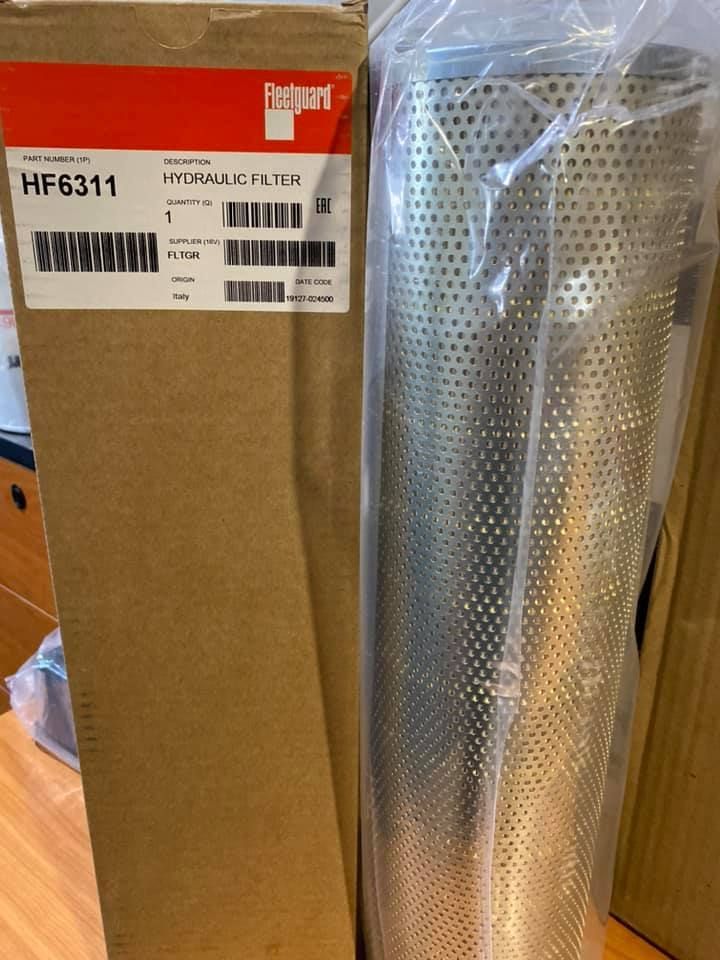 A Hydraulic Filter In A Plastic Bag Next To A Cardboard Box — Filta-Wash Mackay In North Mackay, QLD