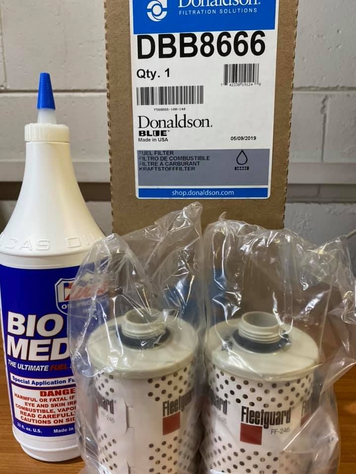 A Bottle Of Bio Med Next To A Package Of Filters — Filta-Wash Mackay In North Mackay, QLD