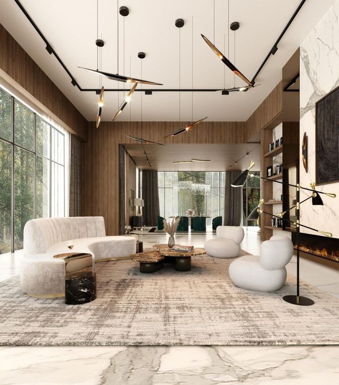 Modern luxury living room with beige seating, marble accents, tall windows, and a large abstract chandelier