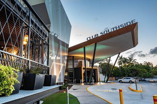 A large building with a sign that says club southside on it.