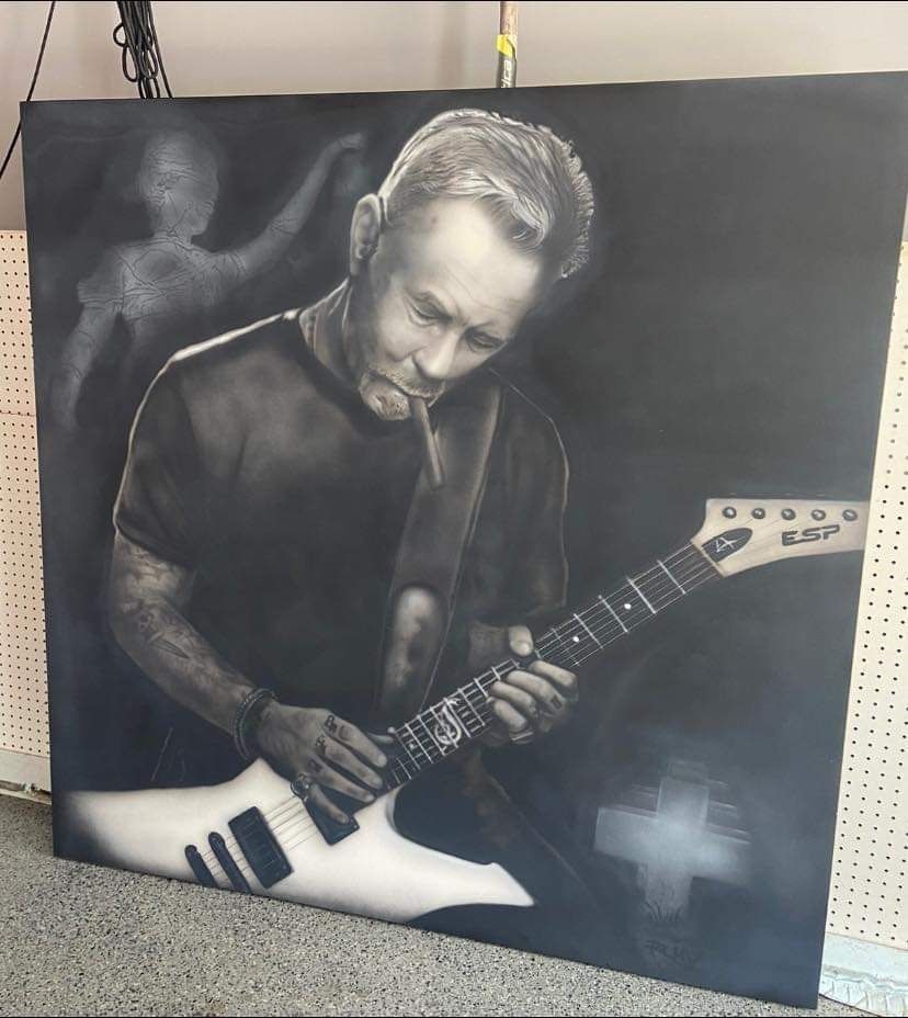 A black and white painting of a man playing a guitar