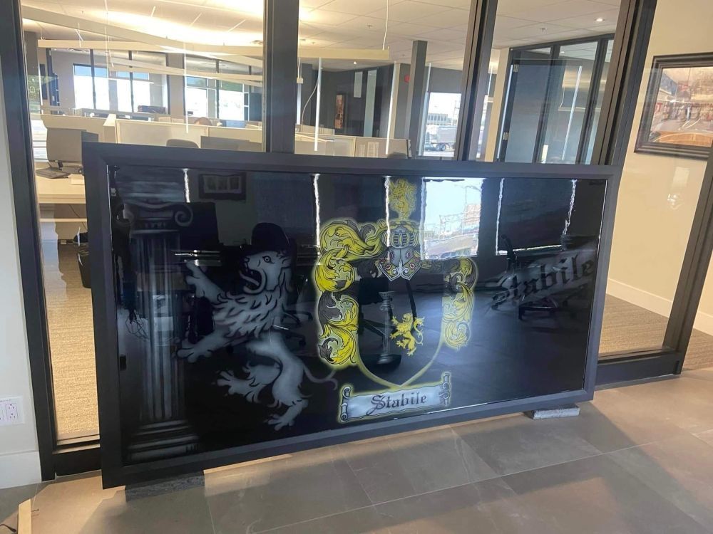 There is a picture of a lion on a window in a room.