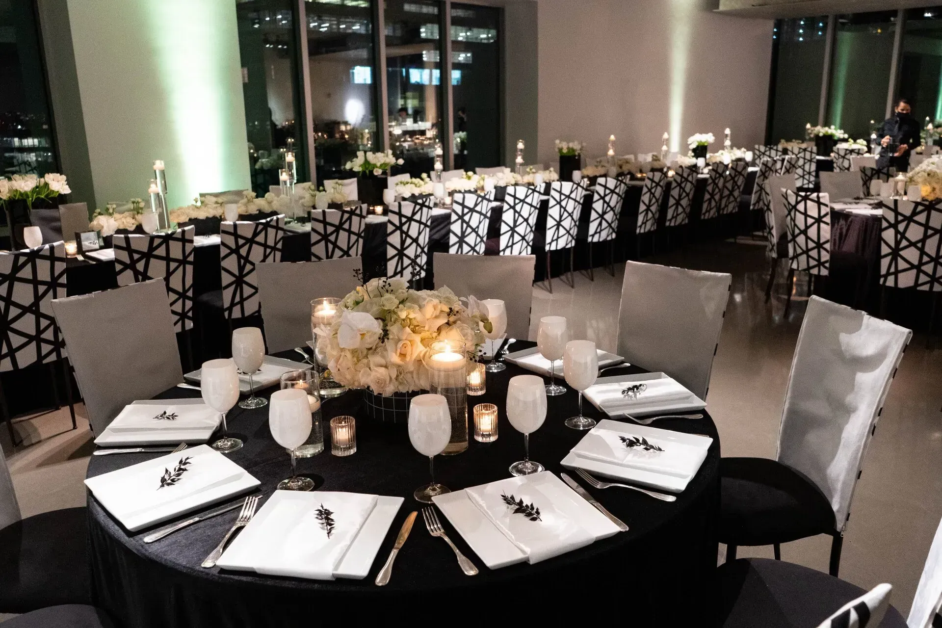 a large room with tables and chairs set up for a party