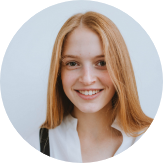 A woman with long red hair is smiling in a circle