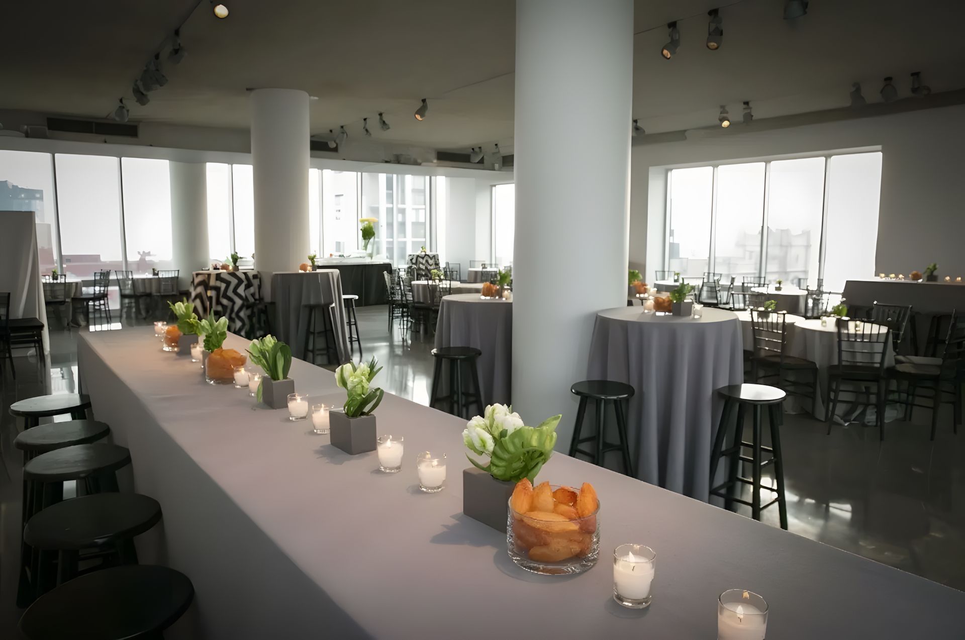 A long table with candles and flowers on it