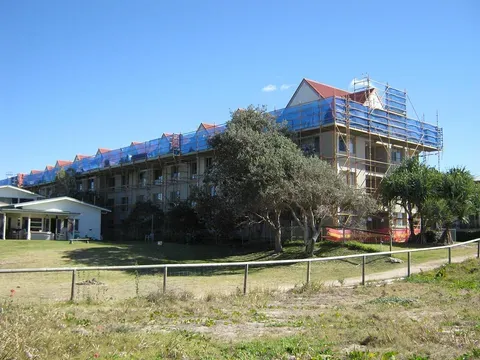 A Large Building With Scaffolding on Top of It is Under Construction — Byron Bay Scaffold in Kinvara, NSW