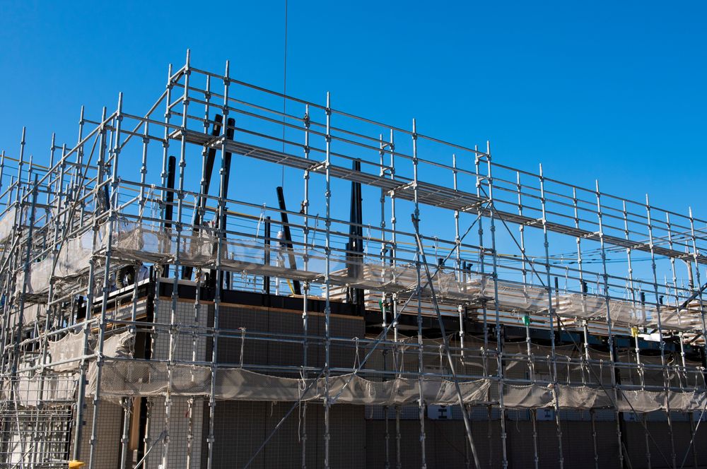 A Building is Being Built With Scaffolding and a Blue Sky in the Background — Byron Bay Scaffold in Kinvara, NSW