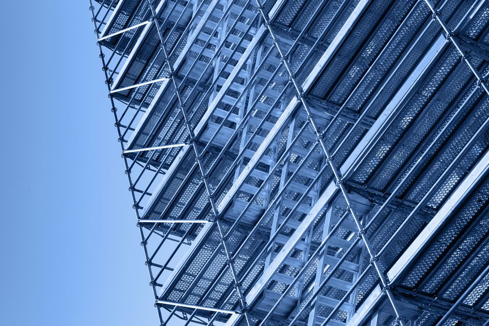 A Close Up of a Building With Scaffolding on It Against a Blue Sky — Byron Bay Scaffold in Currumbin, QLD