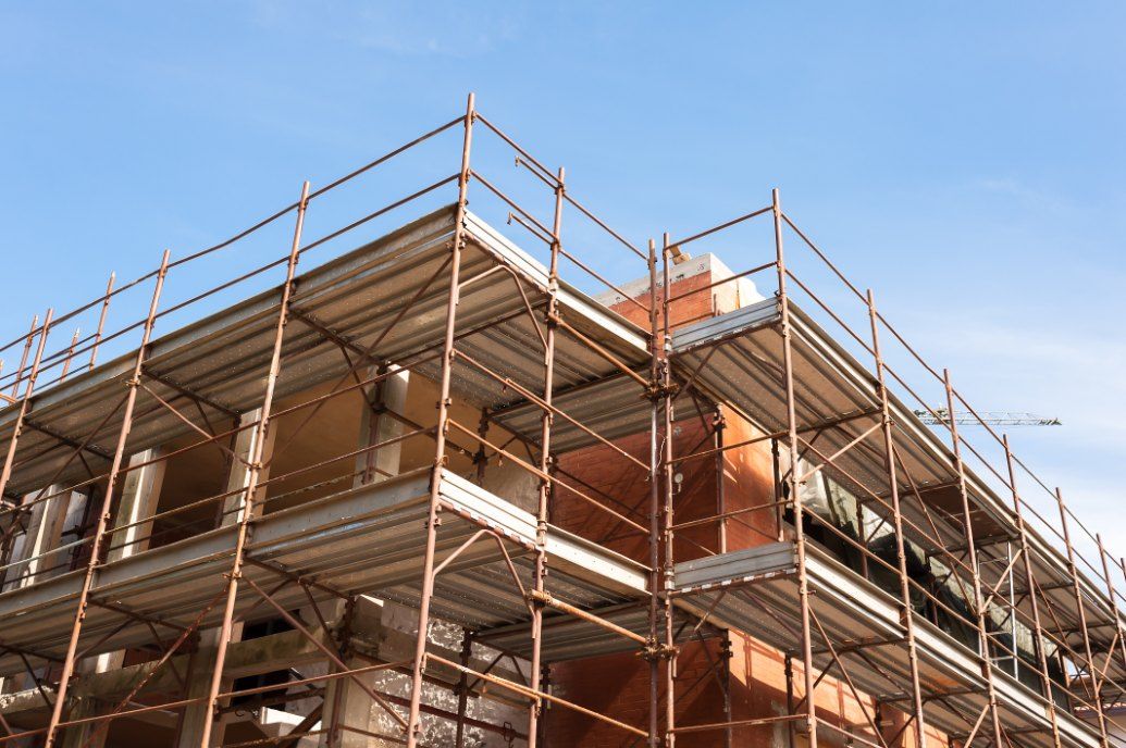 A Building Under Construction With Scaffolding and a Blue Sky in the Background — Byron Bay Scaffold in Coolangatta, QLD