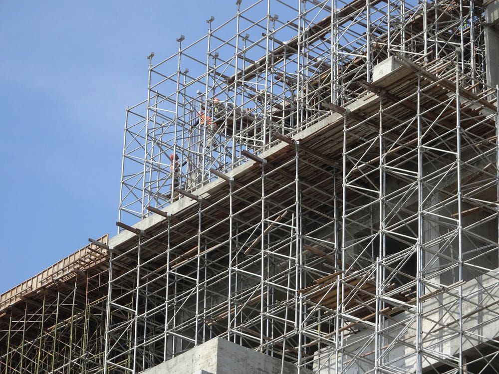 A Building is Being Built With Scaffolding and a Blue Sky in the Background — Byron Bay Scaffold in Palm Beach, QLD