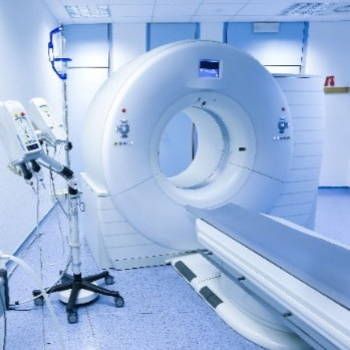 A hospital room with a large ct scan machine