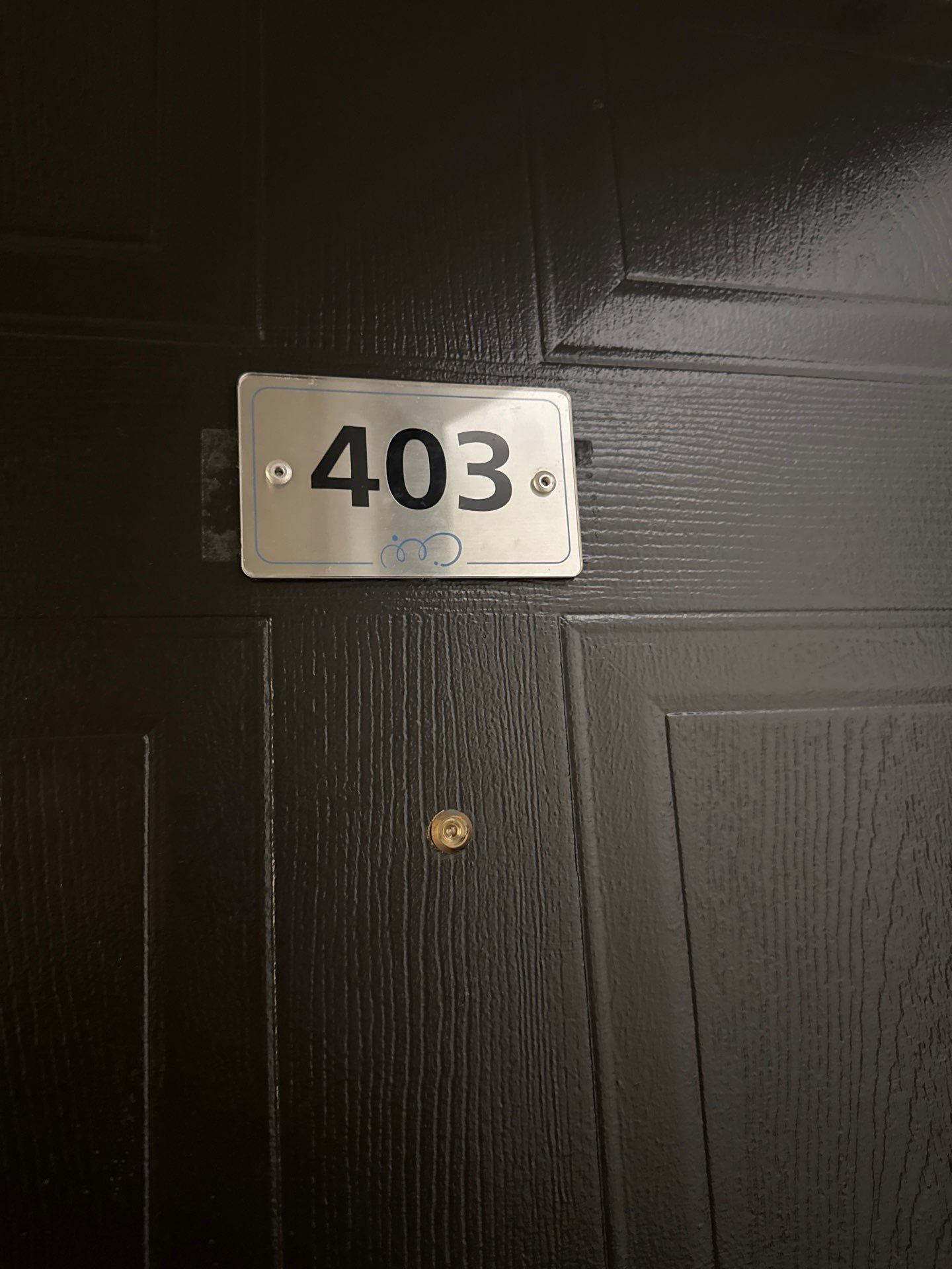A black door with the number 403 on it