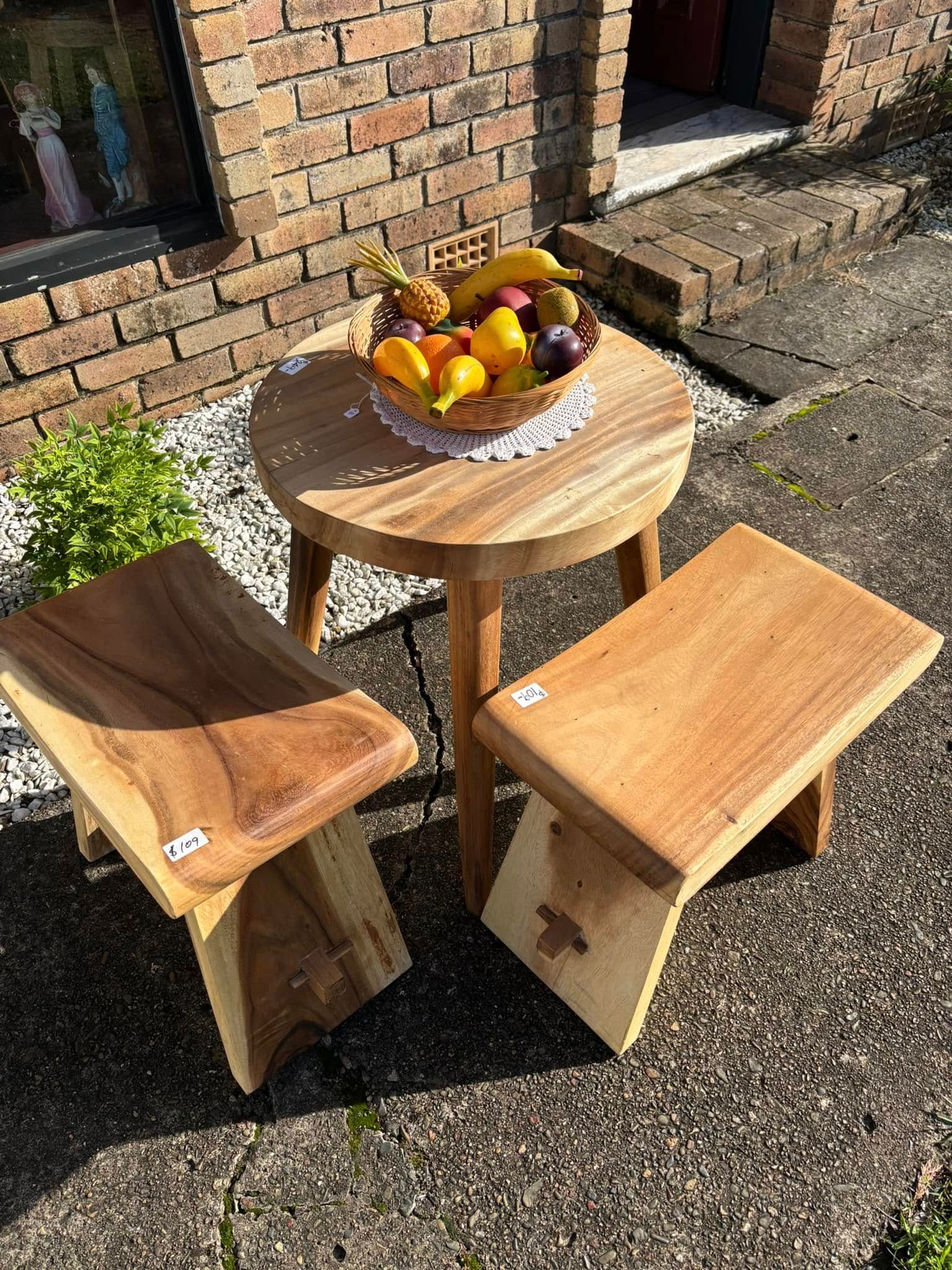 Wooden table and two stools set outside with fruit basket — Clancy's Office And  Emporium in Taree, NSW