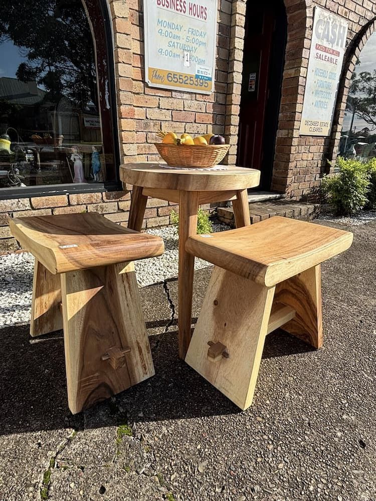 Wooden Stools and a Small Table Sit Outside a Brick Building — Clancy's Office And  Emporium in Taree, NSW