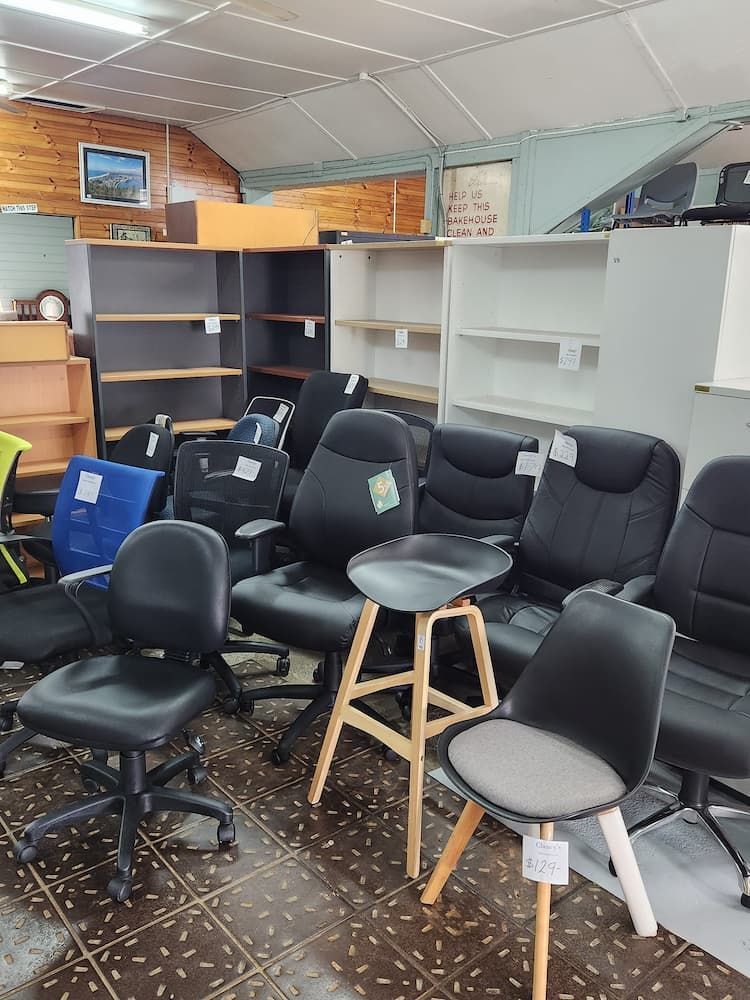 A Showroom With Used Office Furniture Including Chairs and Bookshelves — Clancy's Office And Emporium in Taree, NSW