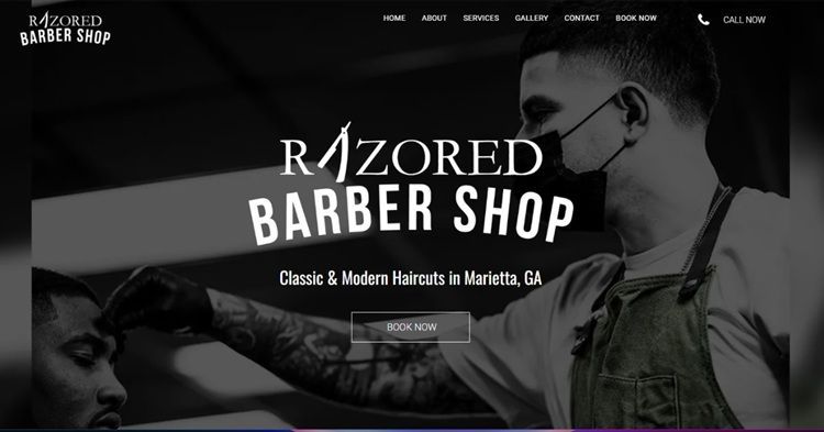 The website for razored barber shop shows a man getting his hair cut.
