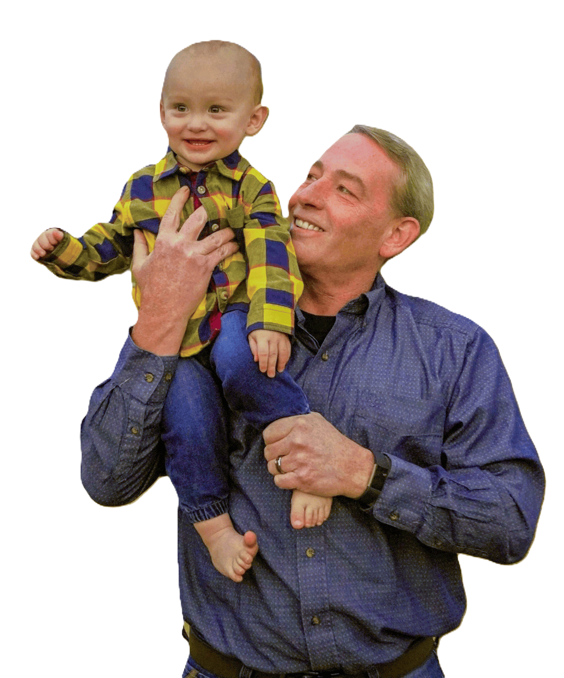 A man is holding a baby on his shoulders