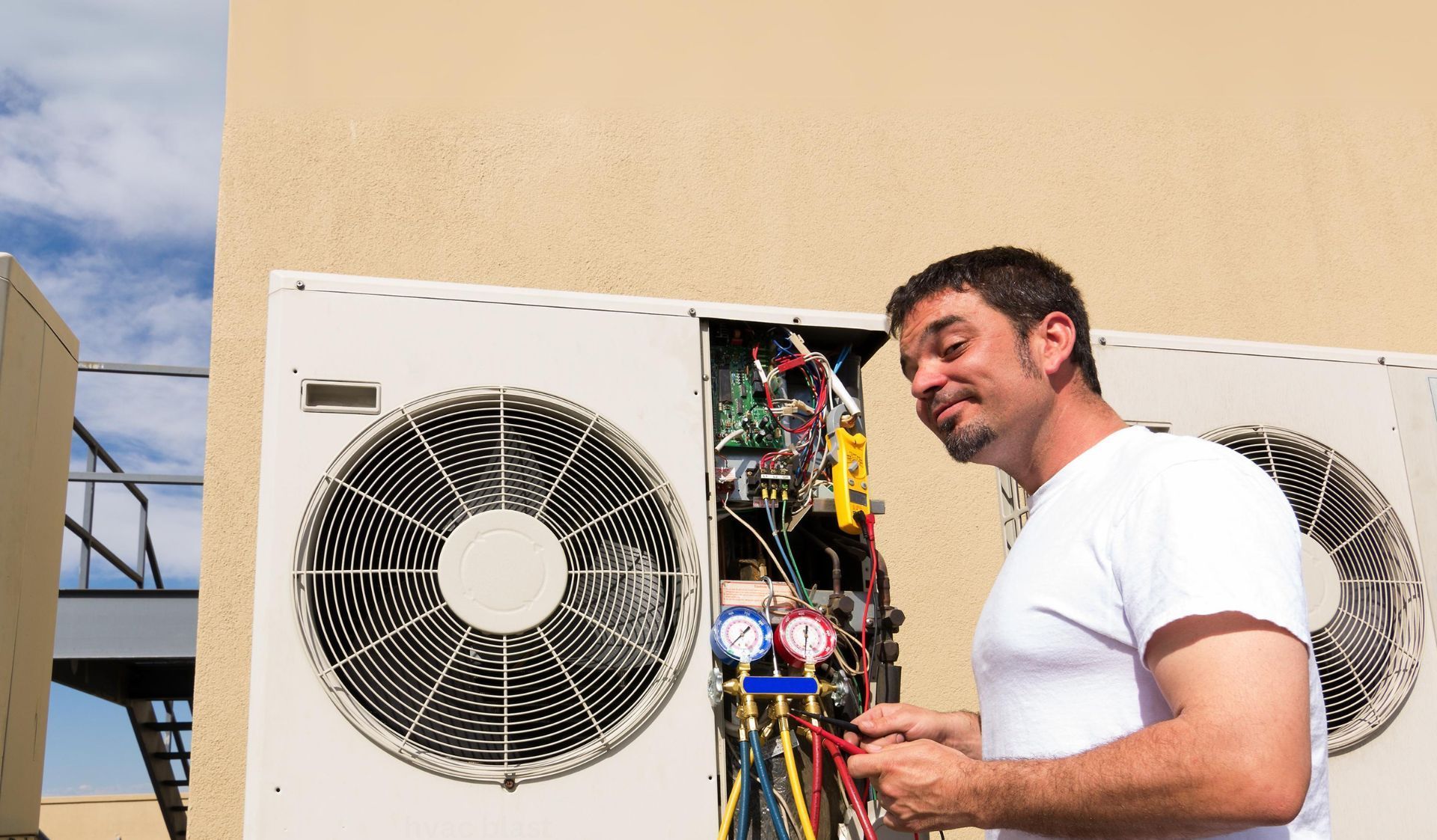 HVAC technician working on an outdoor air conditioner unit