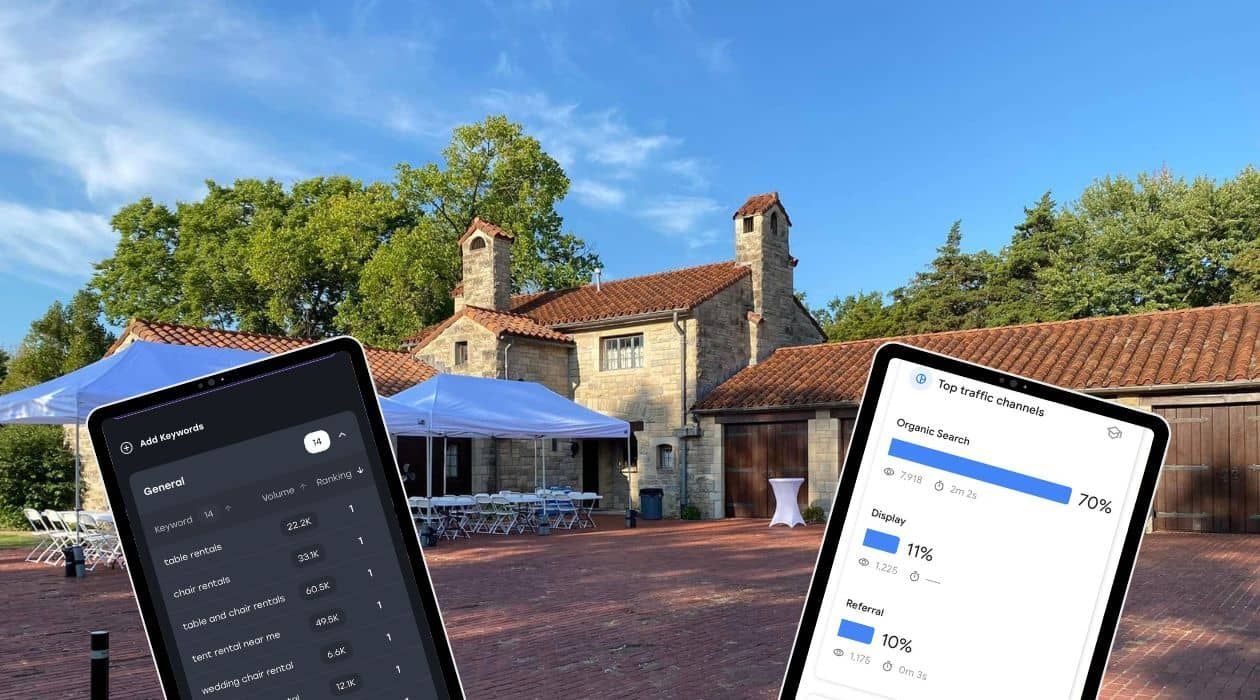 Tablets showing data, in front of a stone building with blue umbrellas, under a blue sky.