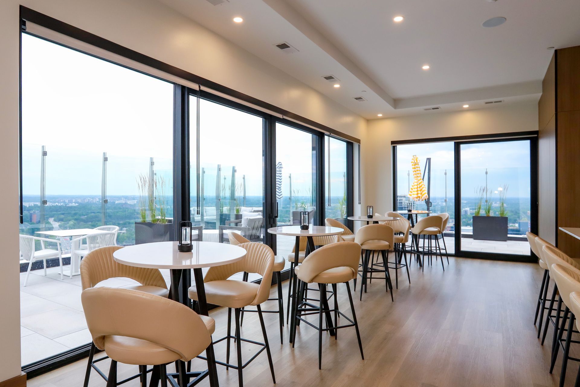 Lounge at Aqui on King. Located on the 33rd floor for residents and their guests featuring a stunning space with oversized windows and doors for an ambience and view like no other!