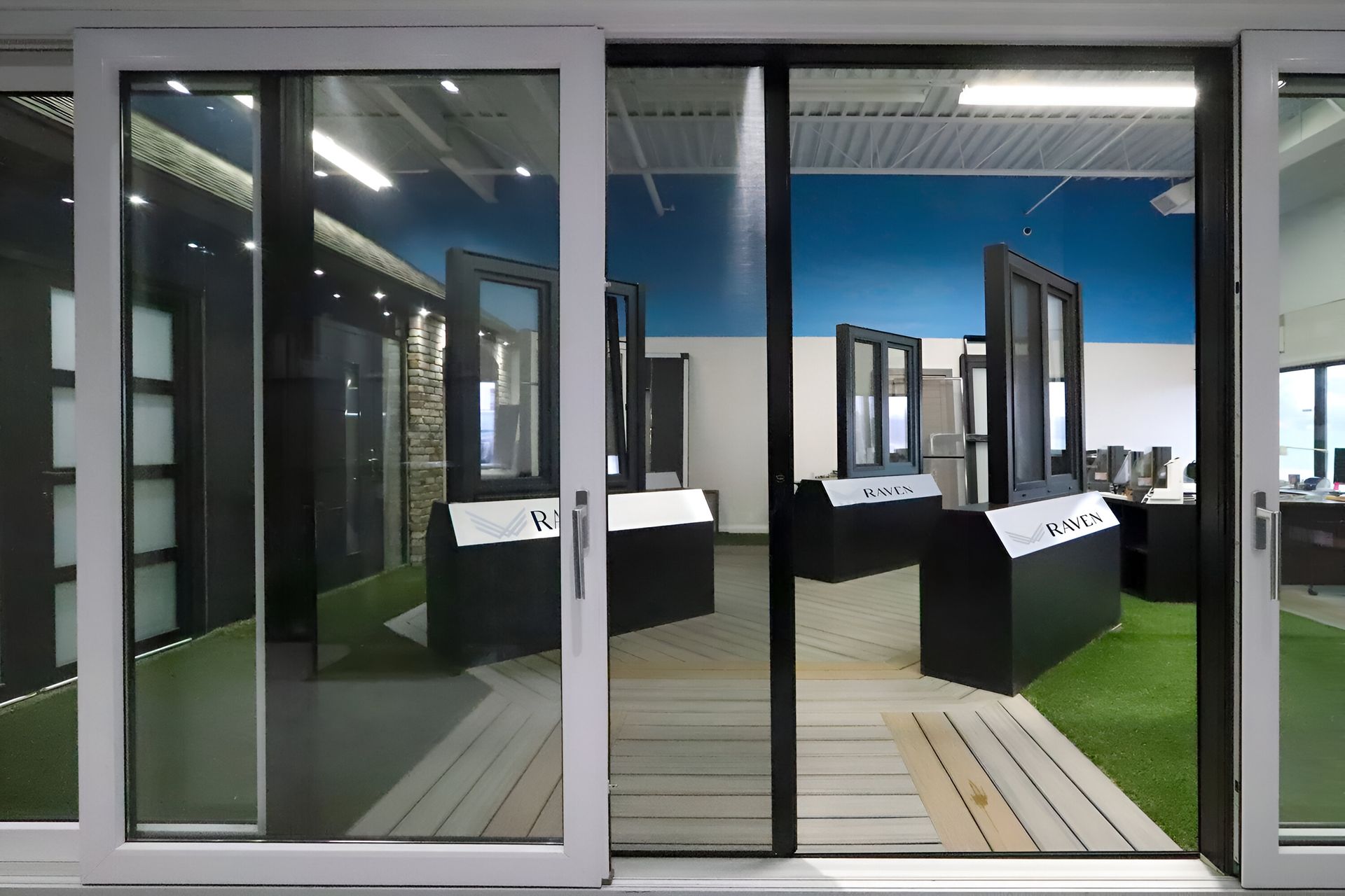 A room with a lot of windows and a sliding glass door