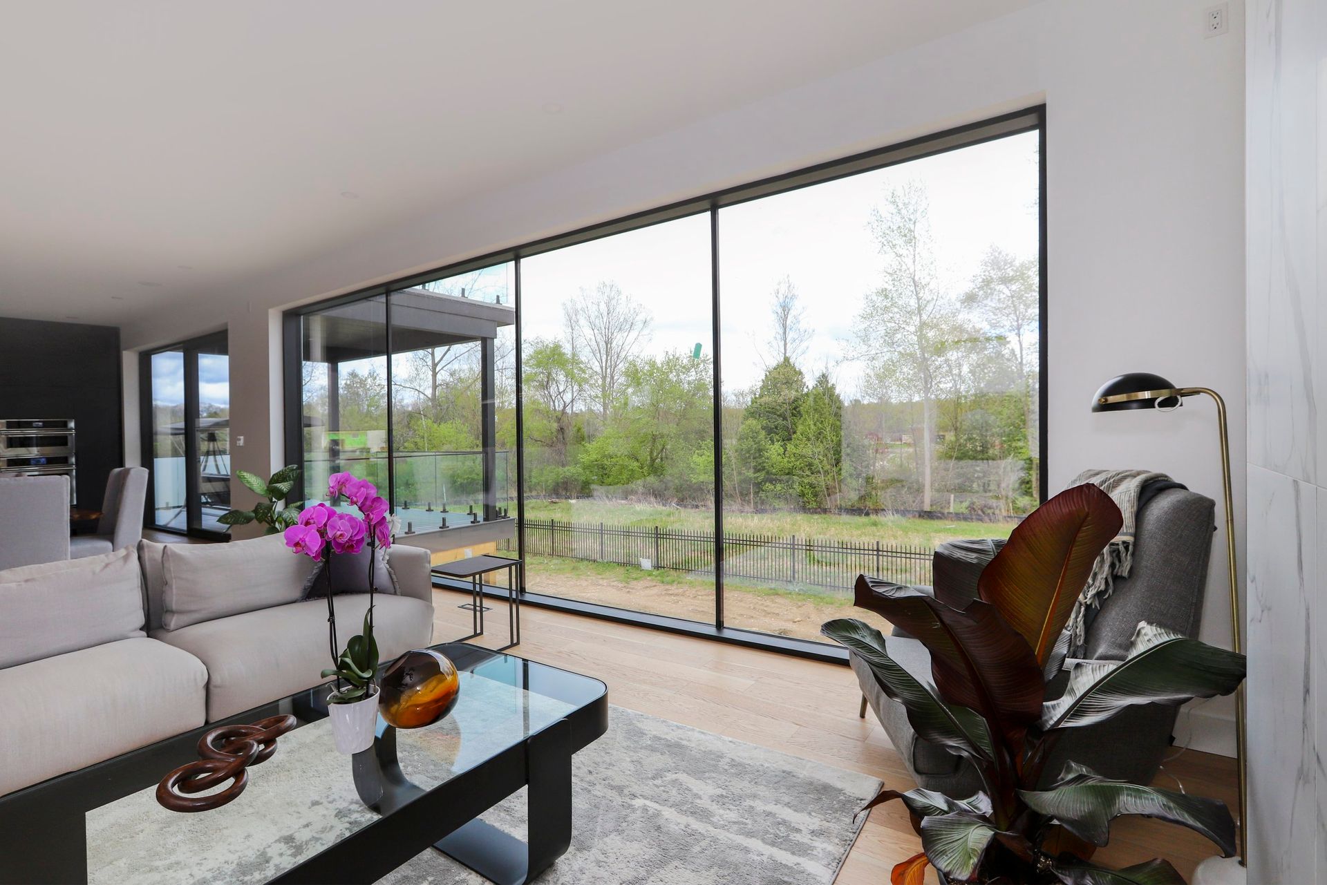 A living room with a lot of windows and a couch.
