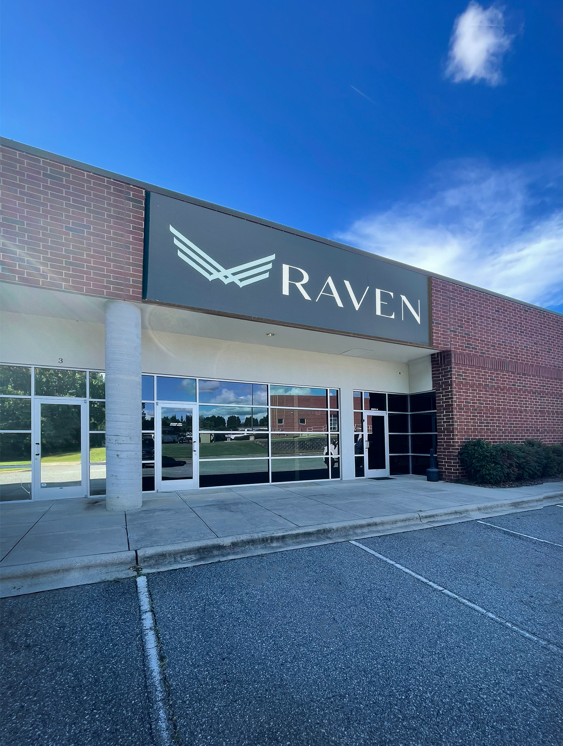 A building with a sign that says raven on it