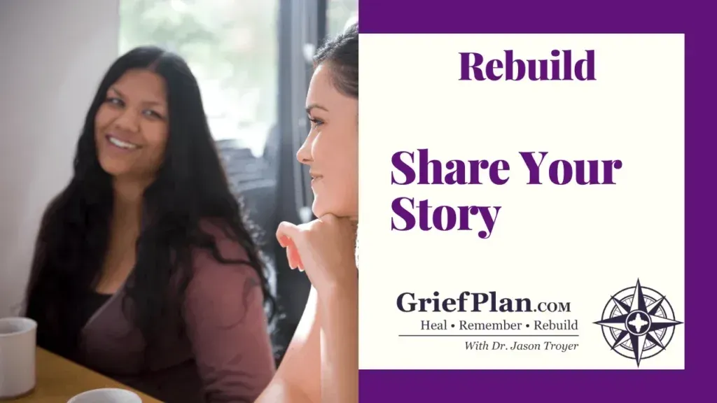 Two women talk indoors beside a sign that says “Rebuild Share Your Story” and “GriefPlan”