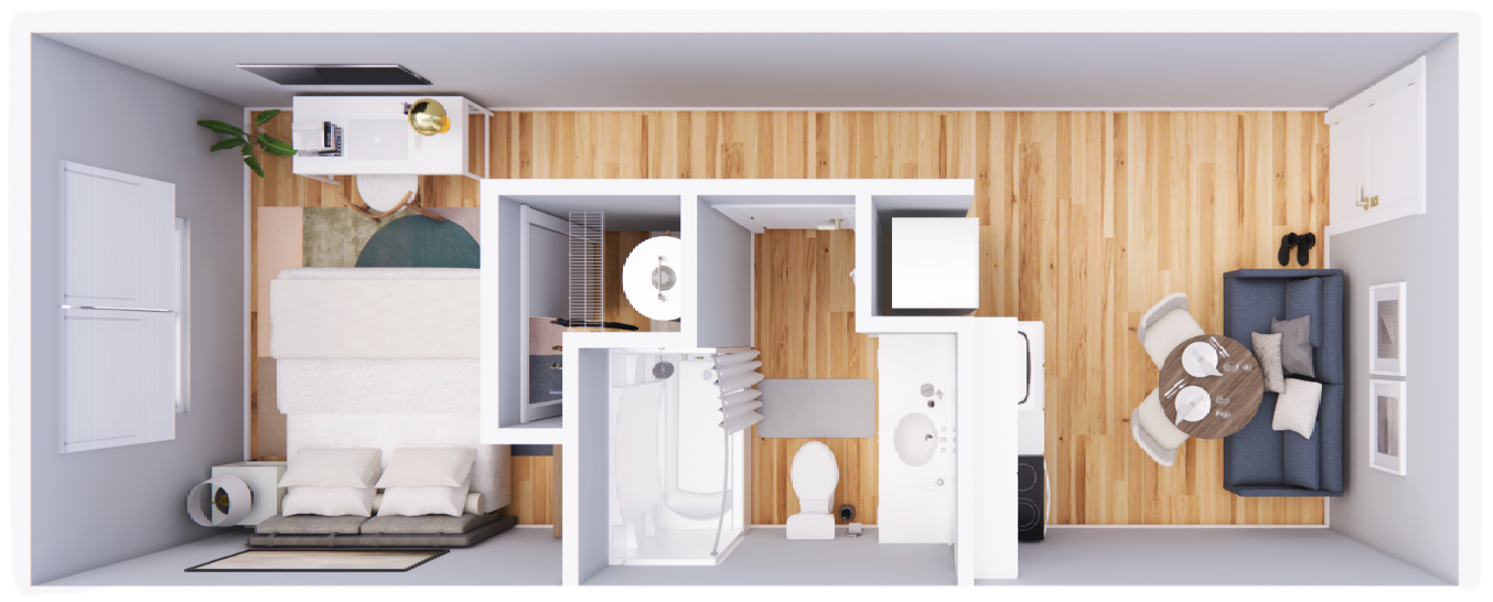 An aerial view of a small apartment with a couch , table , chairs , and a bathroom.