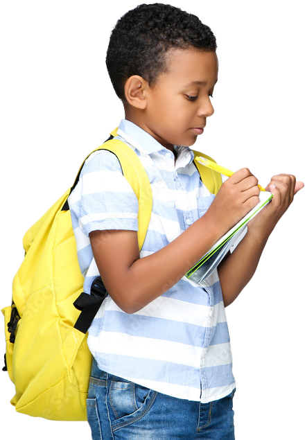 A young boy with a yellow backpack is writing in a notebook